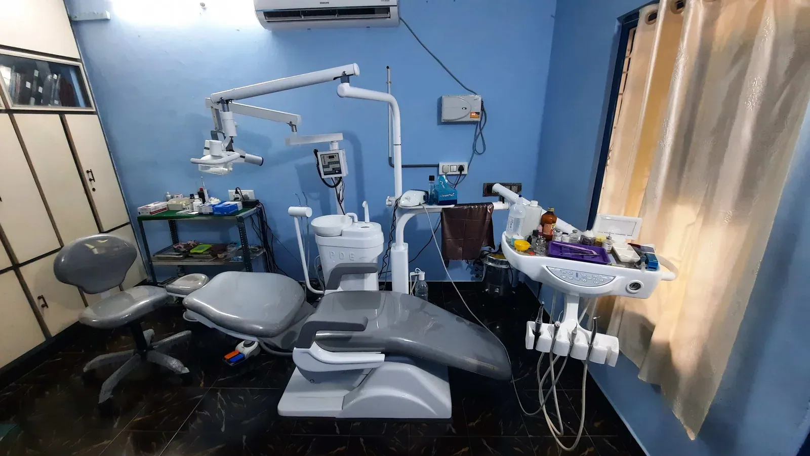 A wider view of the treatment room at Rainbow Dental Multispeciality Clinic, Kakinada.